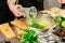 Woman cook adding chopped coriander