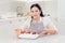 woman cook with cakes anna pavlova decorated strawberries and blueberries