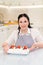 woman cook with cakes anna pavlova decorated strawberries and blueberries