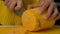 Woman cook cuts pumpkin into small pieces. pumpkin on a wooden board, ingredients for cooking pumpkin cream soup.