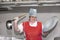 A woman cook in an industrial kitchen with a large