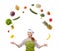 Woman cook juggling with fruits and vegetables