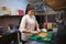 Woman Cook prepares food sushi kitchen
