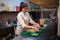 Woman Cook prepares food sushi kitchen