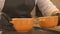 Woman cook putting on tray two bowls with hot soup for serve in restaurant