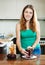 Woman cooking boiled beets with grater