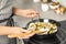 Woman cooking delicious risotto. Tasty recipe