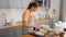 woman cooking food and baking cake on kitchen