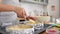 Woman cooking food and baking cake on kitchen