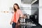 Woman Cooking Food In Domestic Kitchen