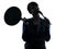 Woman cooking holding frying pan thinking silhouette