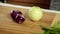 Woman cooking at home - preparing to cut onions