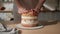 Woman is cooking homemade cake. Pastry chef collects cake from biscuit layers, cake preparation. cooking, baking and