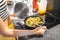 Woman cooking on modern induction cooker stove