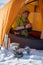 Woman cooking outside tent in wintertime