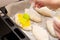 Woman cooking pies and egg yolk greasing