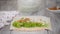 Woman is cooking pita bread roll with chicken and vegetables.