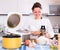 Woman cooking rice in multicooker