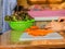 Woman cooking salad,human hands chopping vegetable,vegetarian,carrot,cucumber and red coral lettuce ,home cooking,healthy concept,