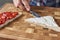 Woman cooking sandwiches toast with a fresh berries in the kitchen