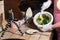 woman cooking spinach muffins step by step, mixing ingredients with spatula