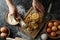 Woman cooking tasty pasta on dark table