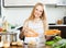 Woman cooking vegetables with electric steamer