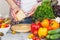 Woman cooks on the kitchen, soft focus background