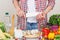 Woman cooks on the kitchen, soft focus background