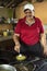 Woman cooks traditional Costa Rican lunch of Gallo Pinto
