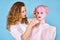 Woman cosmetic doctor draws markup on a mannequin