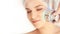 Woman cosmetology procedure. Light face treatment. Medical skin repair. Anti wrinkle. Color skincare