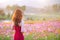 Woman with a Cosmos flower.