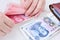 Woman counting Chinese yuan banknotes