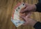 Woman counting euro banknotes