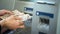 Woman counting Japanese Yen withdrawn from ATM, 24 hours service, easy banking