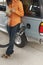 Woman Counting Money At Petrol Pump