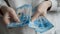 A woman counts banknotes with her hands. Russian money, rubles.