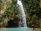 Woman couple alone in deep forest waterfall, inambakan falls in Cebu Island in Philppines