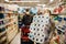 Woman couple with mask and gloves panic buying and hoarding toilette paper in supply store.Pathogen virus pandemic quarantine.