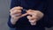 Woman covering nails applying top coat on gel polish at home, hands closeup.