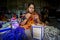 A woman crafts maker is making a showpiece home from the fibers of a banana tree at Madhupur, Tangail