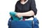 Woman crammed full of clothes and shoulder bag isolated