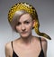 Woman and crawling snake on her head