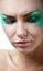 Woman with creative green makeup