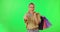 Woman, credit card and shopping bags on green screen for purchase against a studio background. Portrait of happy female