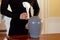 Woman with cremation urn at funeral in church