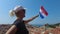 Woman with Croatian flag on Dubrovnik walls