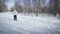 Woman Cross-Country Skiing Alone in Nature