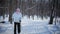 Woman Cross-Country Skiing Alone in Nature